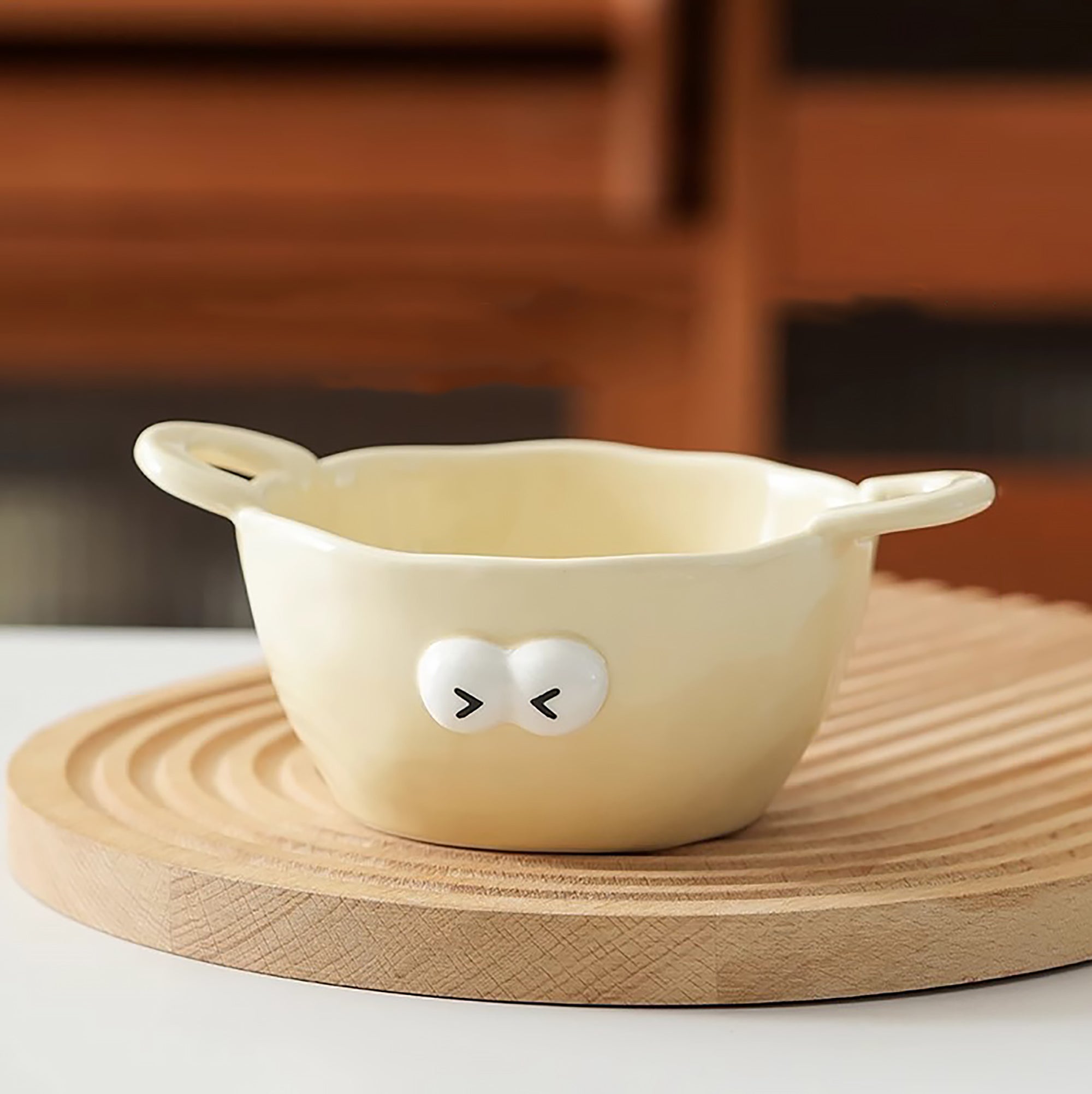 Bol en céramique à deux anses motif emoji yeux ronds
