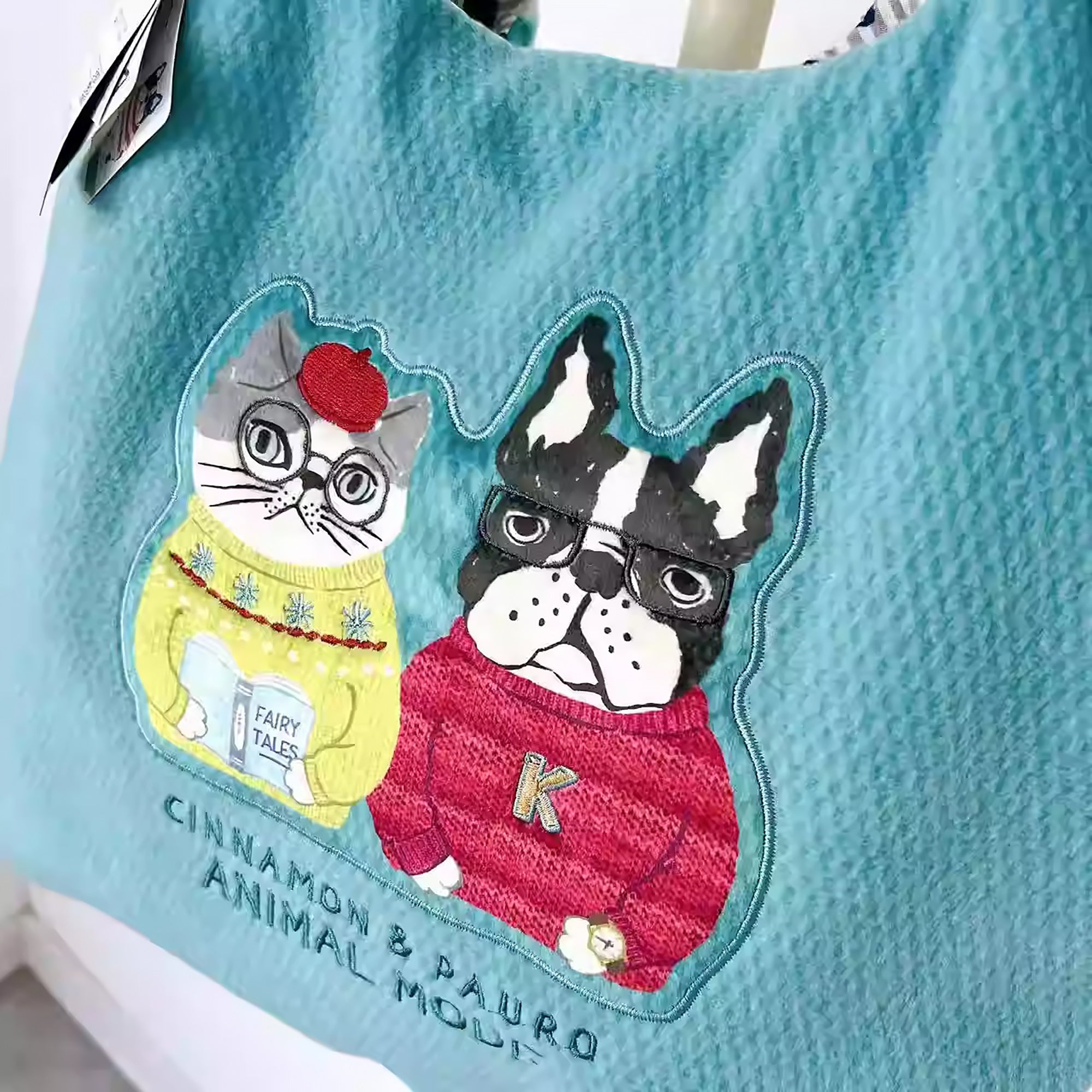 Sac de cours Kusuguru en tissu polaire avec broderie