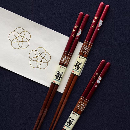 Baguettes japonaises en bois naturel rouge nacré motif zodiac