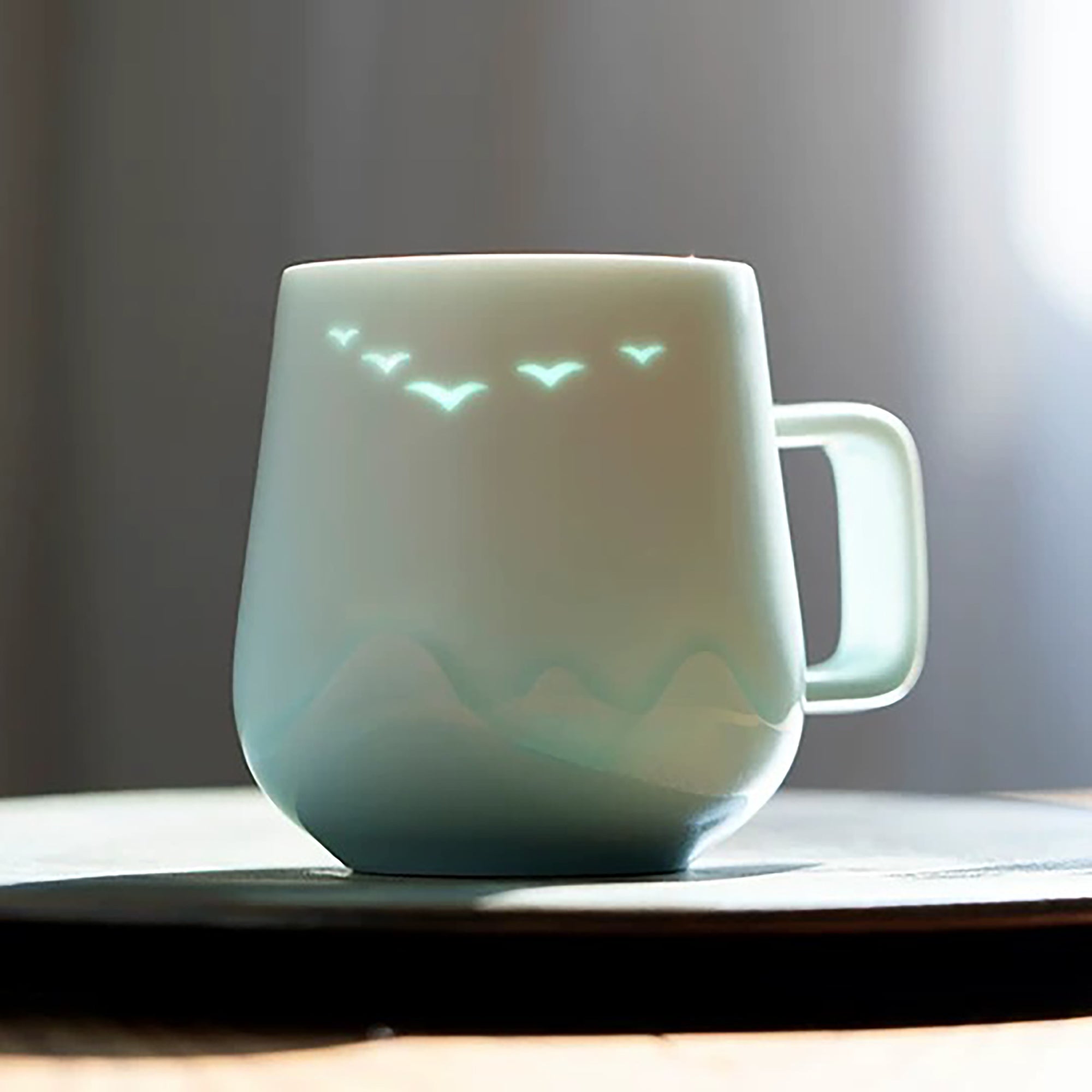 Mug en porcelaine style translucide avec motif oiseaux et pêcheur