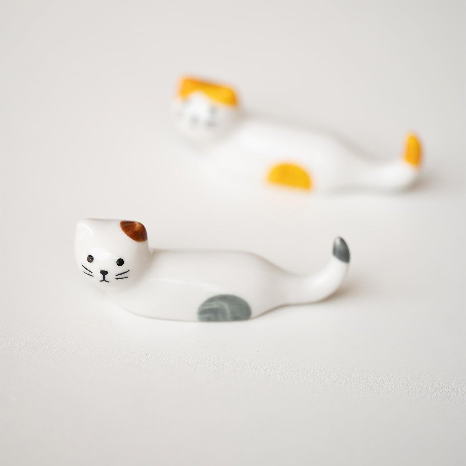 Repos-baguettes en forme de chat allongé 