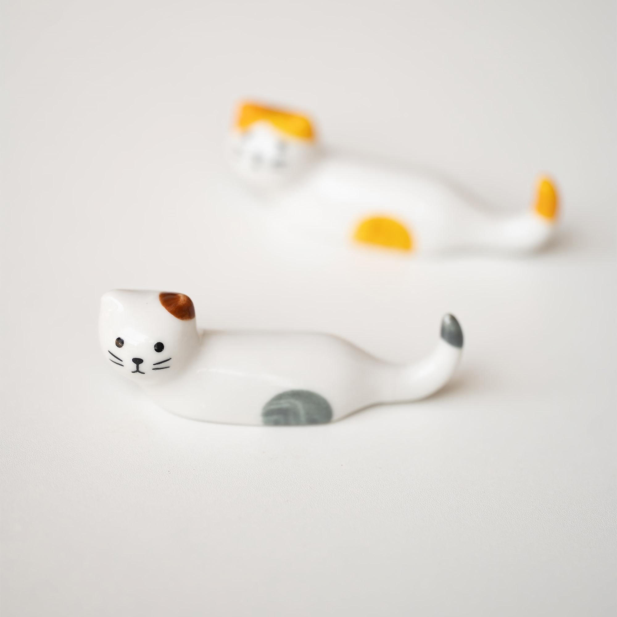 Repos-baguettes en forme de chat allongé 