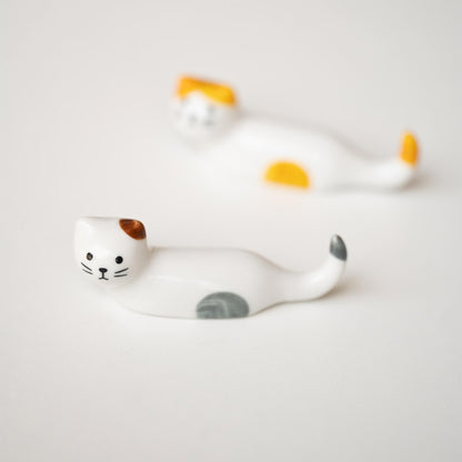 Repos-baguettes en forme de chat allongé 
