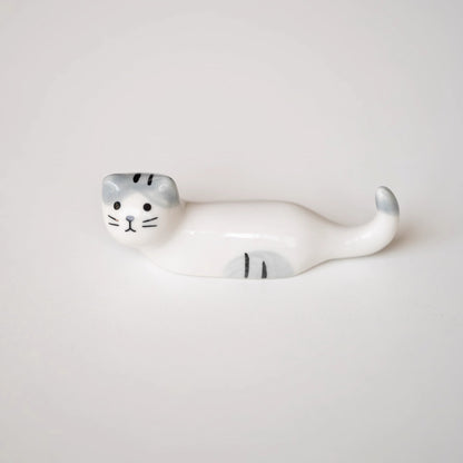 Repose-baguettes en forme de chat allongé