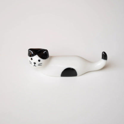Repose-baguettes en forme de chat allongé