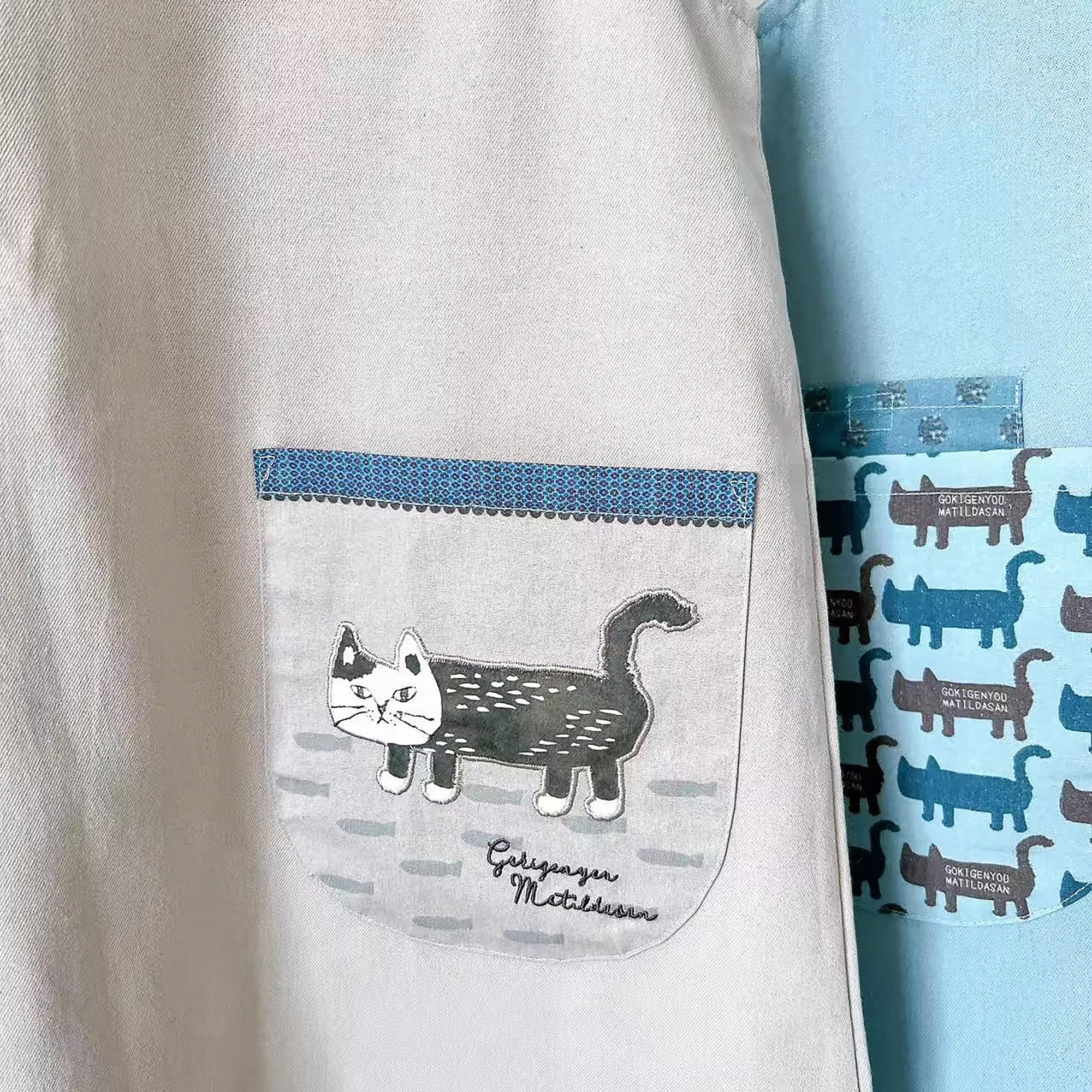 Japanische Schürze mit Kusuguru-Katzenmotiv