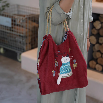 Sac de cours Kusuguru en tissu polaire avec broderie