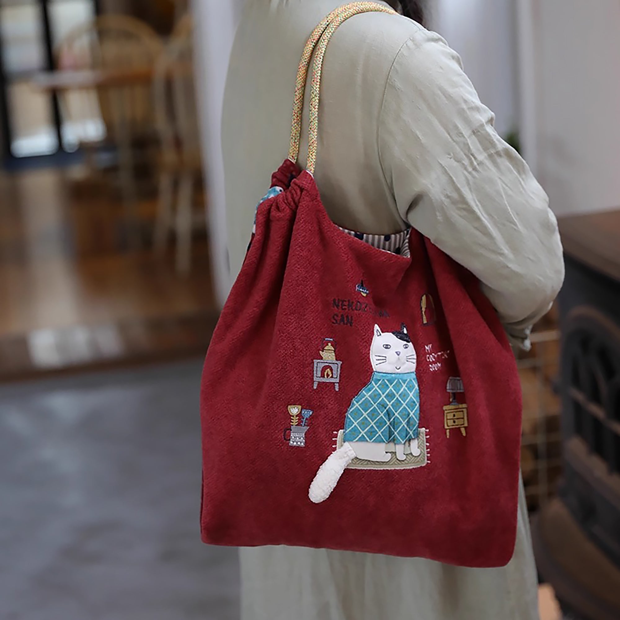 Sac de cours Kusuguru en tissu polaire avec broderie